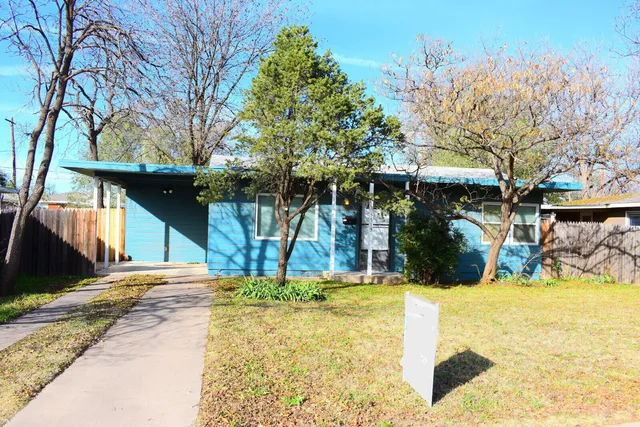 a view of a house with snow on the wall