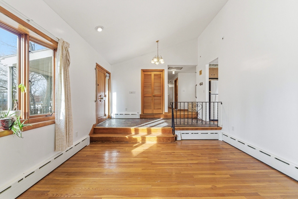 7 Carol Street Stoneham, MA 02180 - Photo 4 of 28 a view of a room with wooden floor and windows