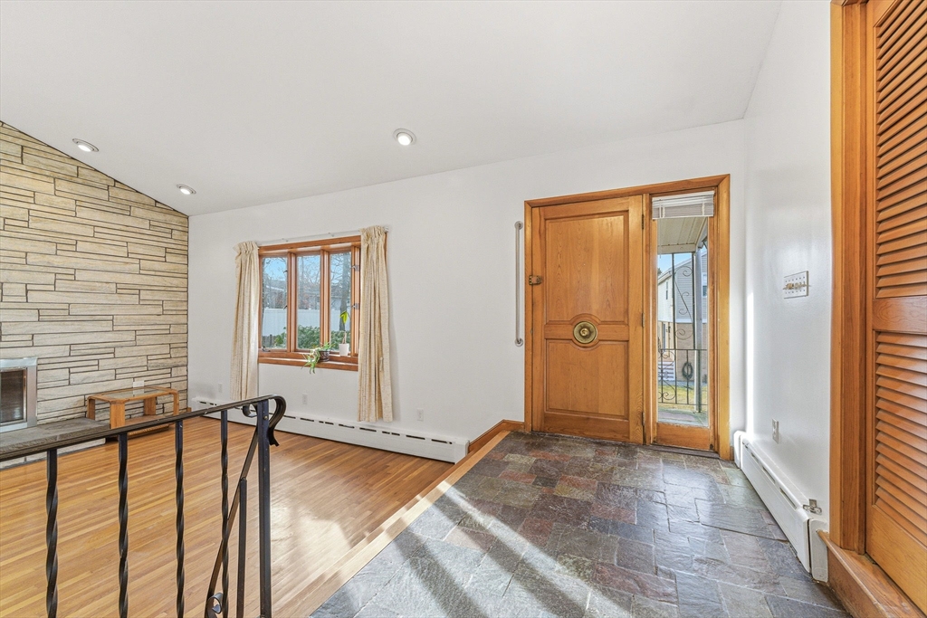 7 Carol Street Stoneham, MA 02180 - Photo 5 of 28 a view of a livingroom with a balcony and a swimming pool