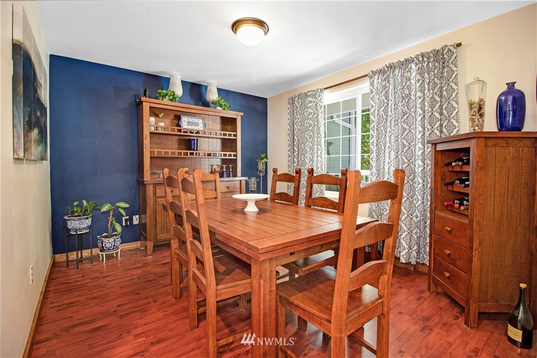 16704 Sargent Road Southwest Rochester, WA 98579 - Photo 14 of 40 a view of a dining room with furniture window and wooden floor