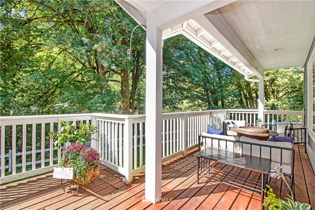 16704 Sargent Road Southwest Rochester, WA 98579 - Photo 3 of 40 a view of a balcony with wooden floor