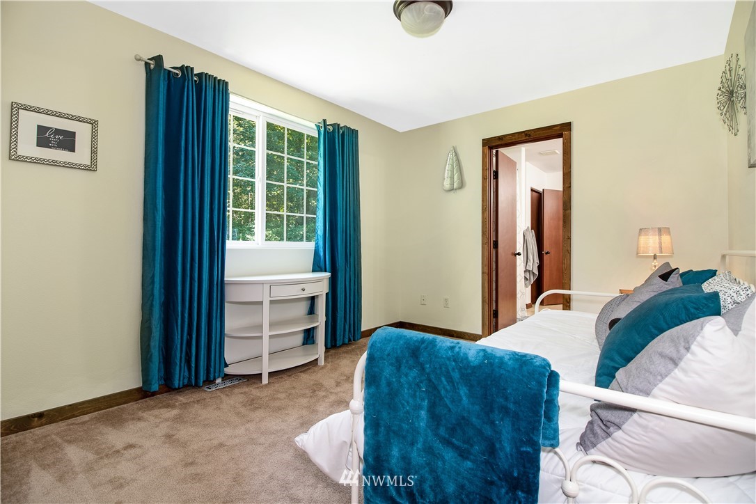 16704 Sargent Road Southwest Rochester, WA 98579 - Photo 25 of 40 a bedroom with a bed and a window
