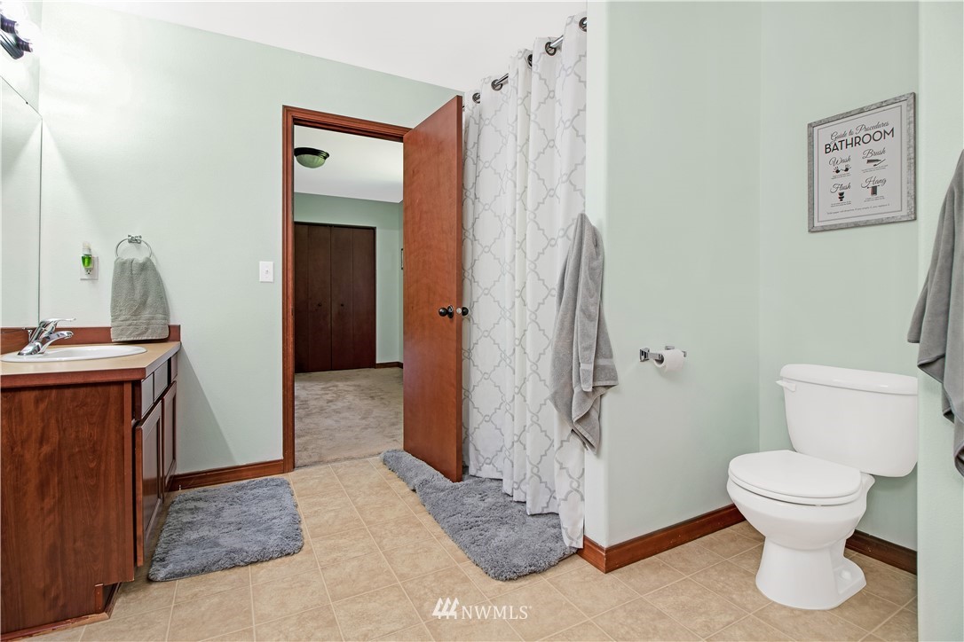 16704 Sargent Road Southwest Rochester, WA 98579 - Photo 28 of 40 a bathroom with a toilet and a shower