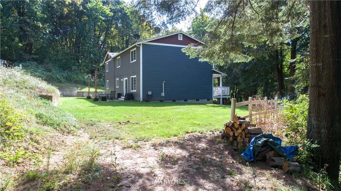 16704 Sargent Road Southwest Rochester, WA 98579 - Photo 32 of 40 a view of a house with a yard