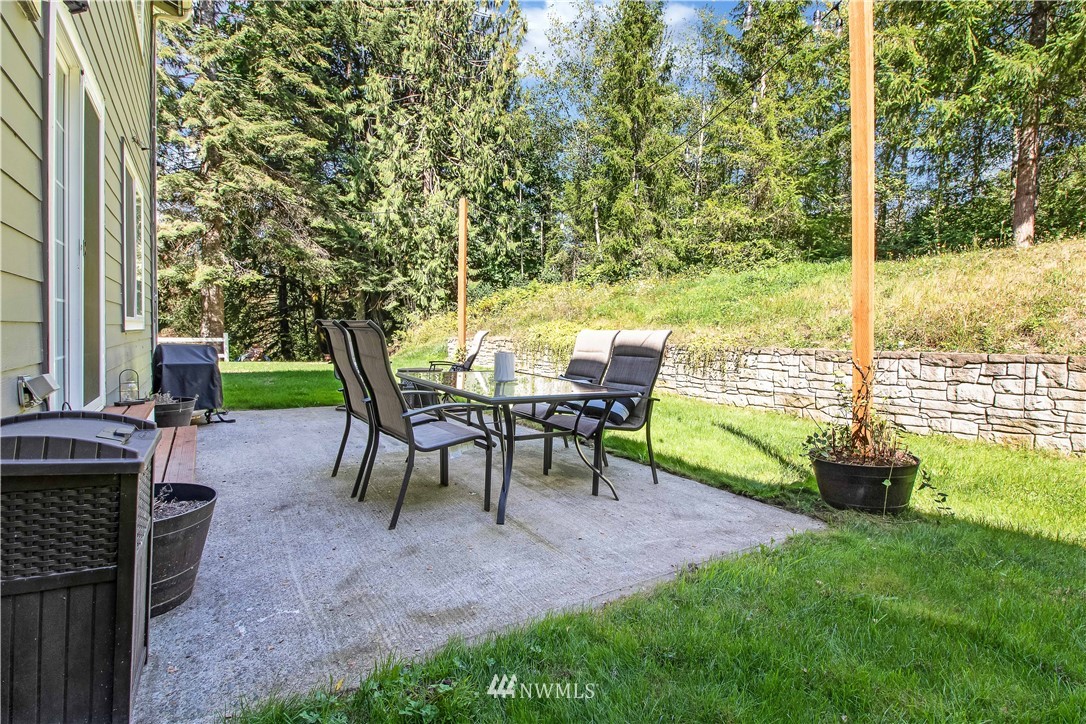 16704 Sargent Road Southwest Rochester, WA 98579 - Photo 33 of 40 a view of a backyard with sitting area
