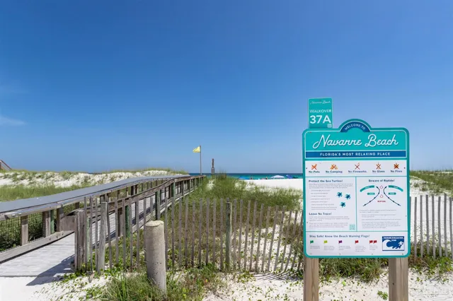 $375,000 | 7453 Sunset Harbor Drive, Unit 107, Navarre Beach, FL 32566