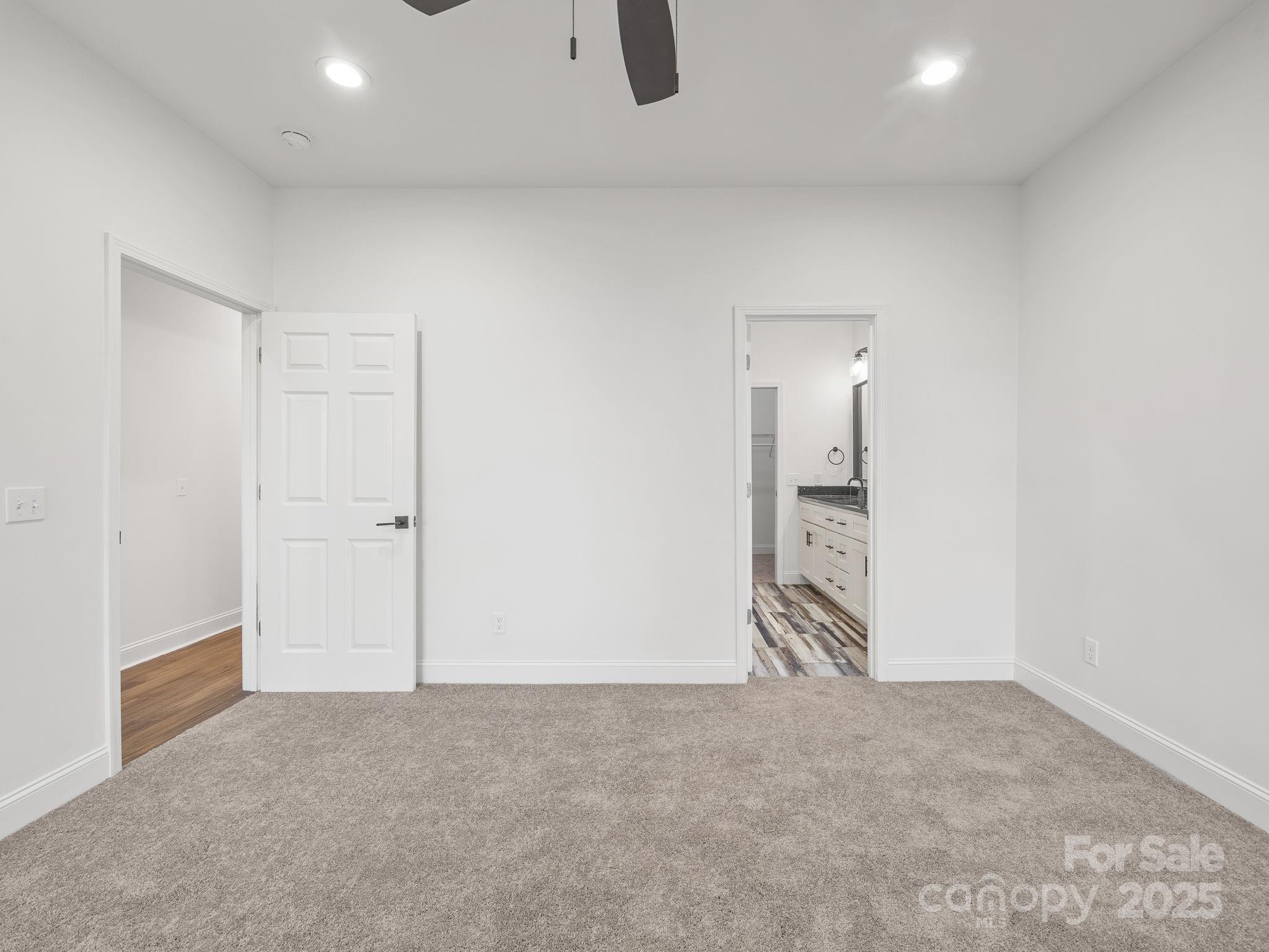 409 South Lyles Avenue Landrum, SC 29356 - Photo 18 of 36 an empty room with sliding door and natural light