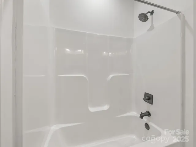 a close up of a bathtub curtain