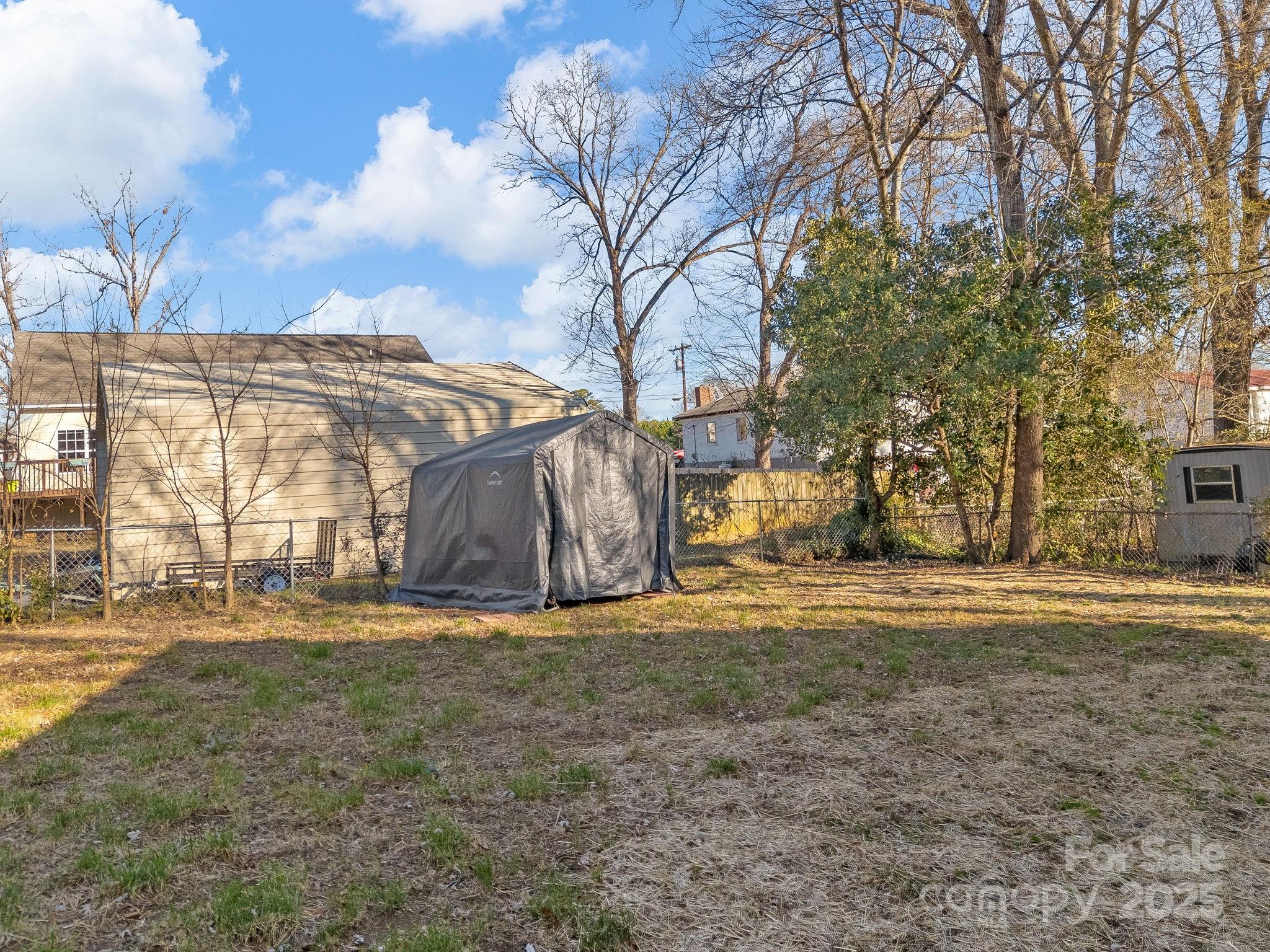409 South Lyles Avenue Landrum, SC 29356 - Photo 30 of 36 a view of a yard with a large tree