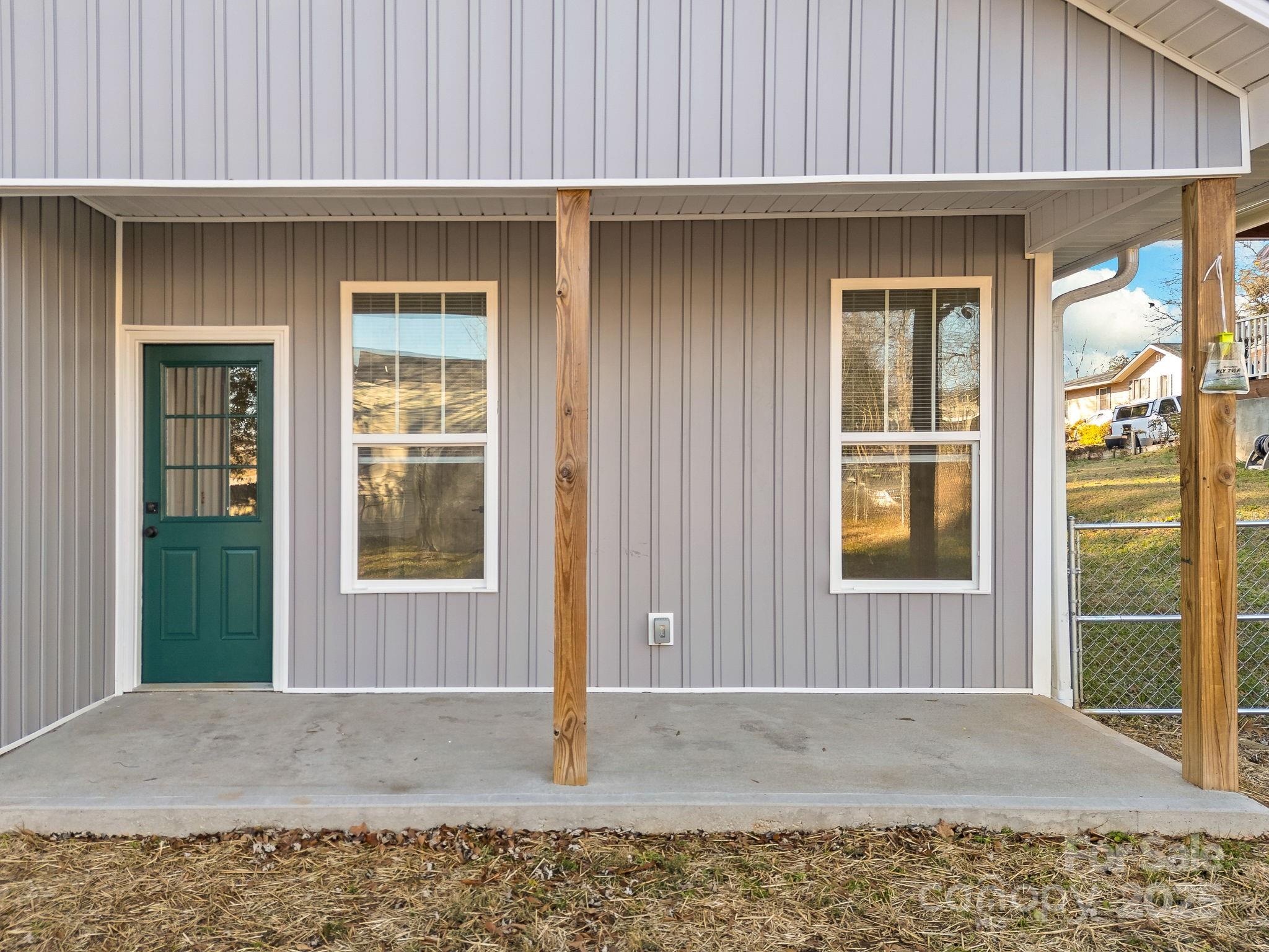 409 South Lyles Avenue Landrum, SC 29356 - Photo 33 of 36 a view of a house with a door and wooden walls
