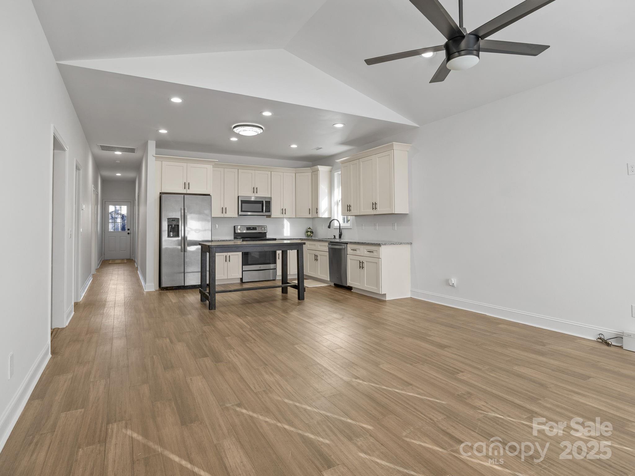 409 South Lyles Avenue Landrum, SC 29356 - Photo 7 of 36 a view of kitchen with wooden floor