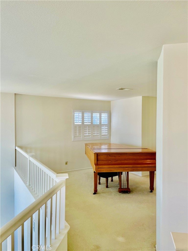 43222 Darby Street Lancaster, CA 93535 - Photo 8 of 9 a reading room with furniture and a wooden floor