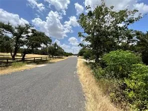 a view of swimming pool with outdoor seating and trees