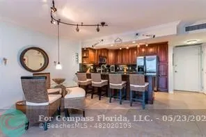 a living room with lots of furniture and a large window