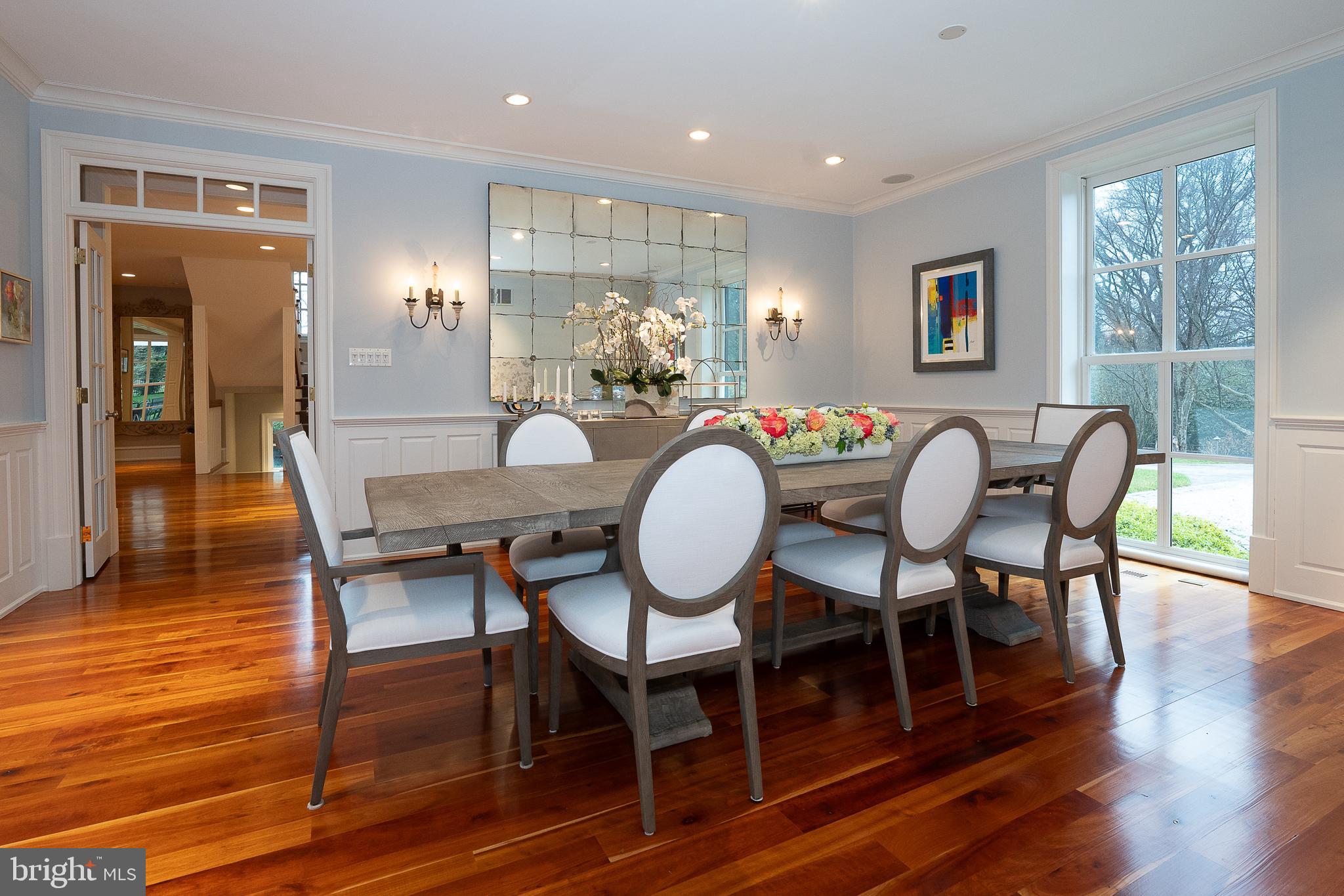 1122 Brynlawn Road Villanova, PA 19085 - Photo 25 of 46 a dining room with furniture a chandelier and wooden floor