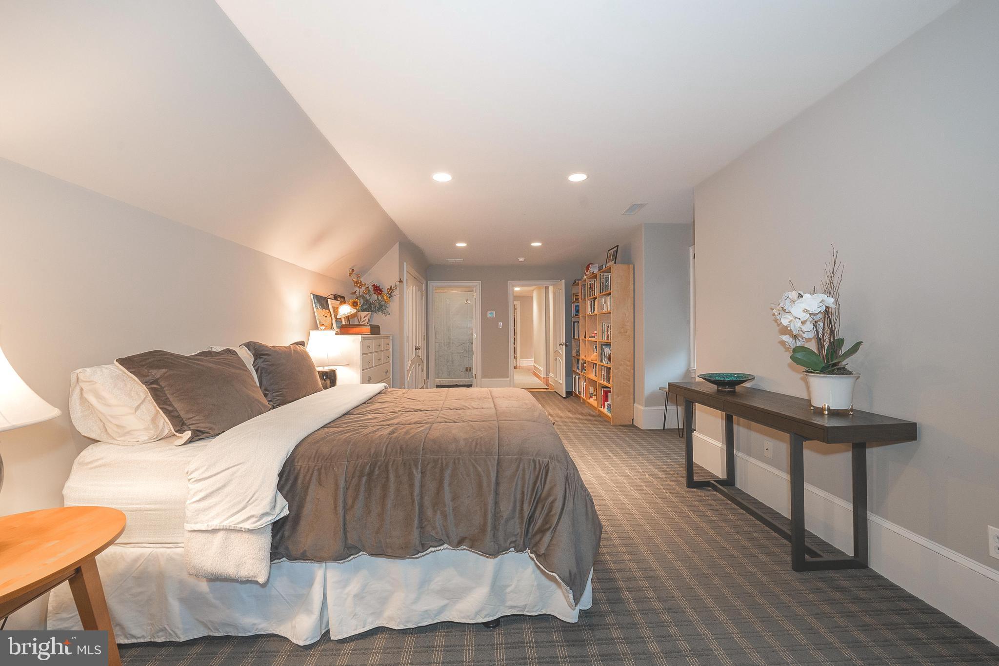 1122 Brynlawn Road Villanova, PA 19085 - Photo 32 of 46 a spacious bedroom with a bed and a table