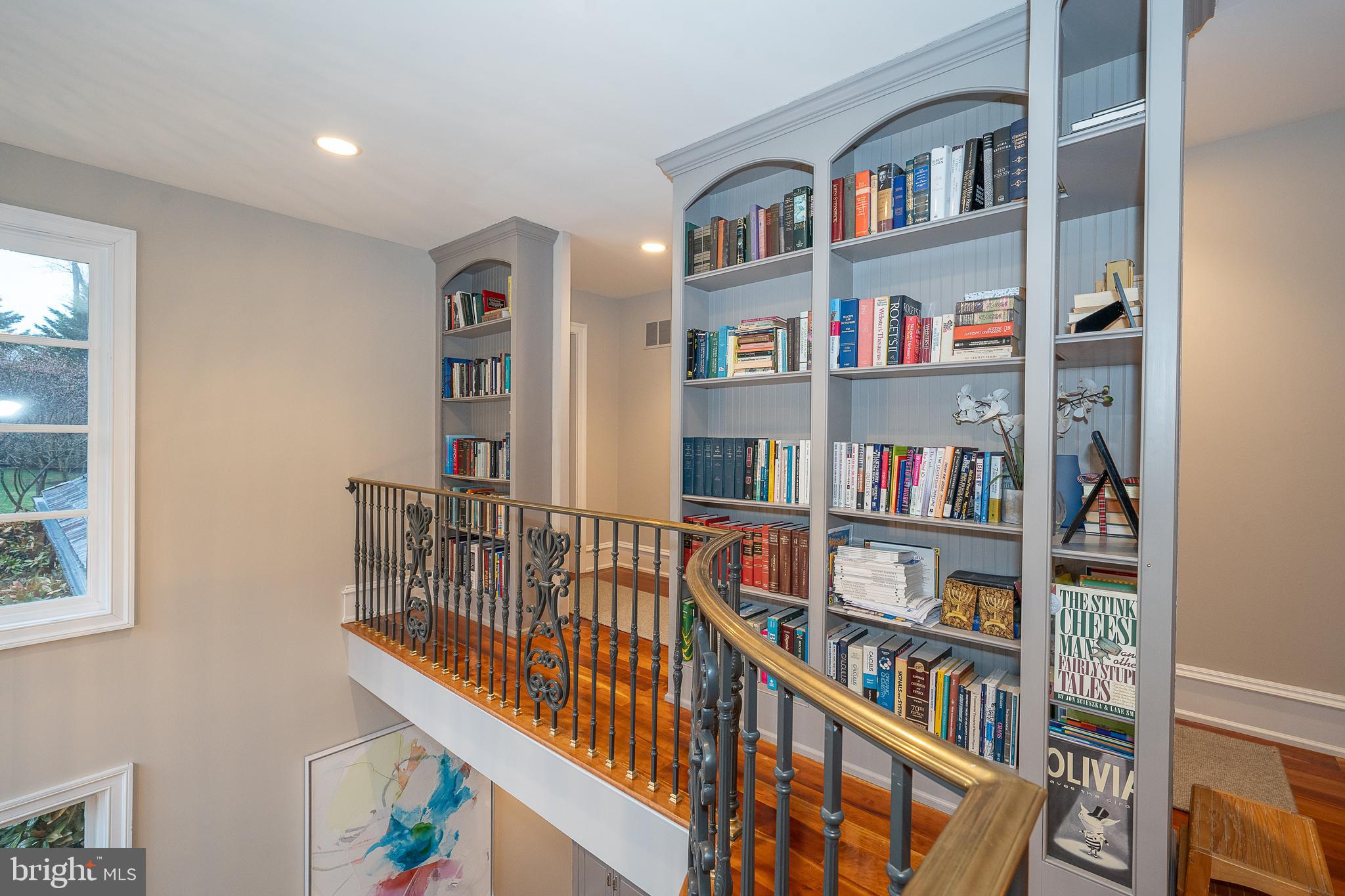 1122 Brynlawn Road Villanova, PA 19085 - Photo 33 of 46 a living room with lots of books