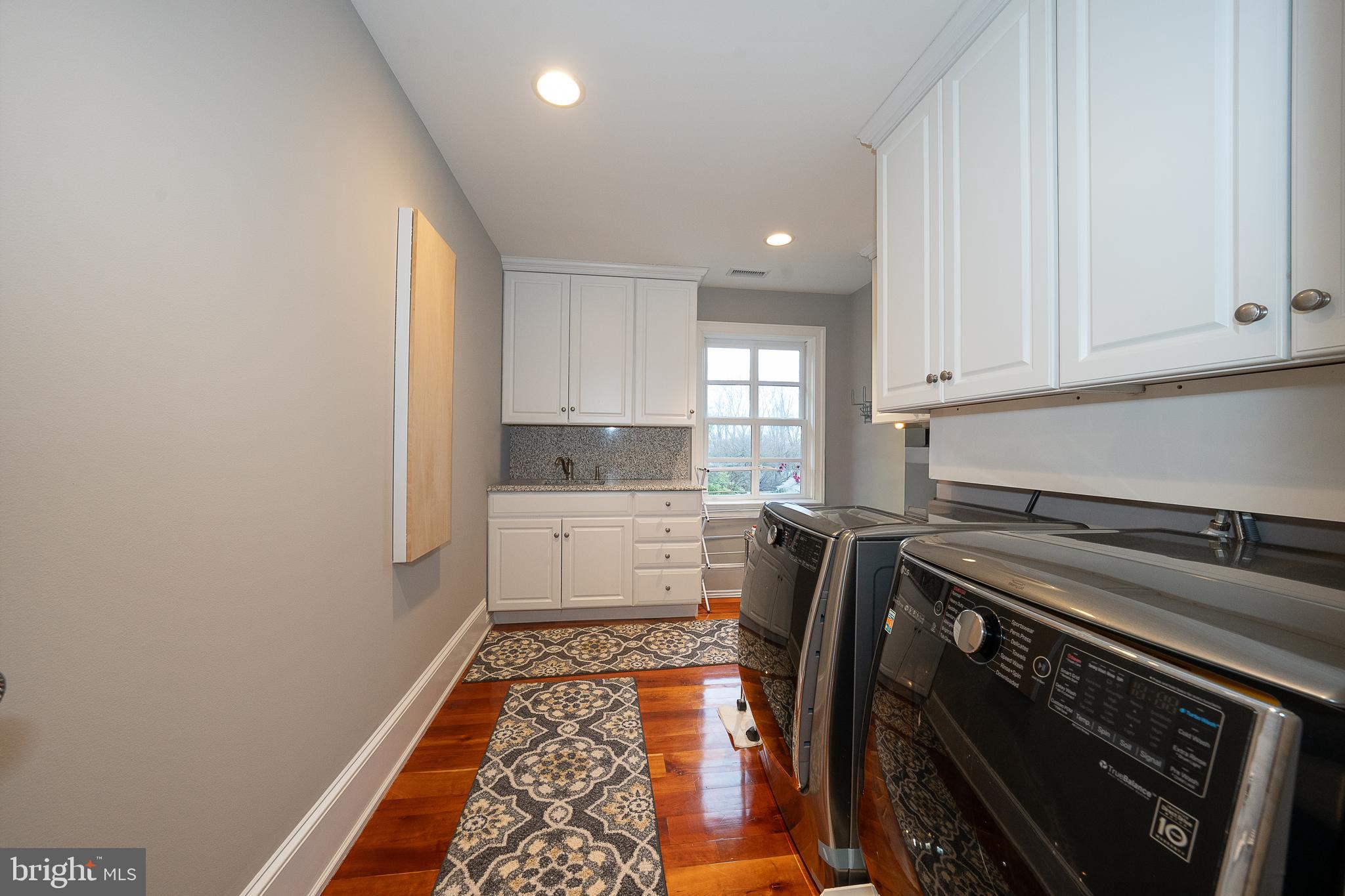 1122 Brynlawn Road Villanova, PA 19085 - Photo 36 of 46 a kitchen with a sink stove and cabinets