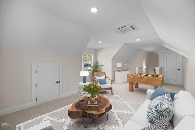 an aerial view of a houses with a lake view