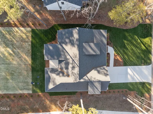 a living room with fireplace furniture and a wooden floor