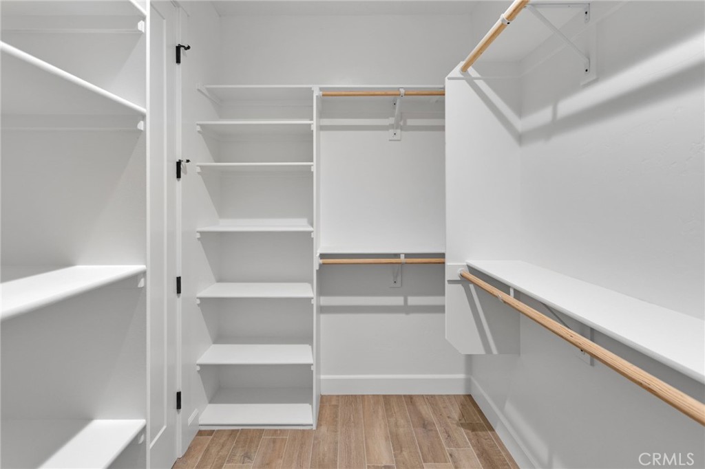 16618 Country Ranch Court Victorville, CA 92395 - Photo 17 of 31 a view of walk in closet with empty racks