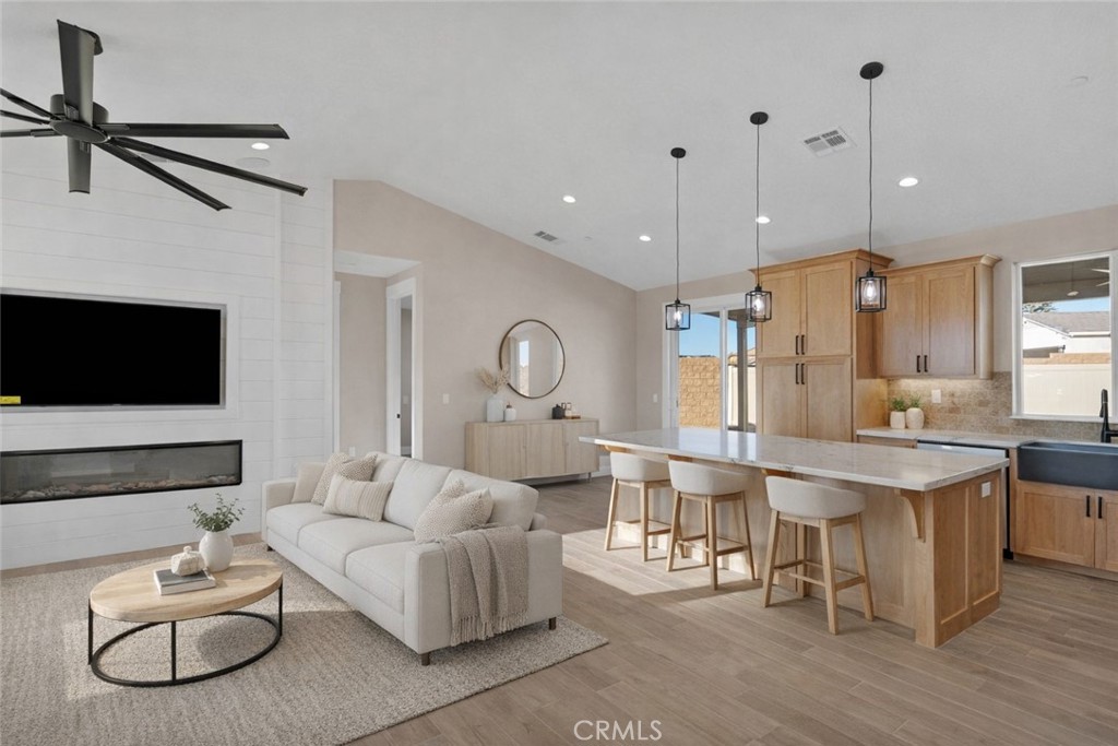 16618 Country Ranch Court Victorville, CA 92395 - Photo 5 of 31 a living room with furniture kitchen view and a flat screen tv