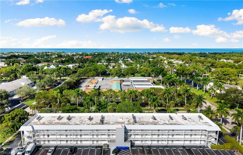 72 7th Street South, Unit 305 Naples, FL 34102 - Photo 1 of 26 a view of a yard and an chairs