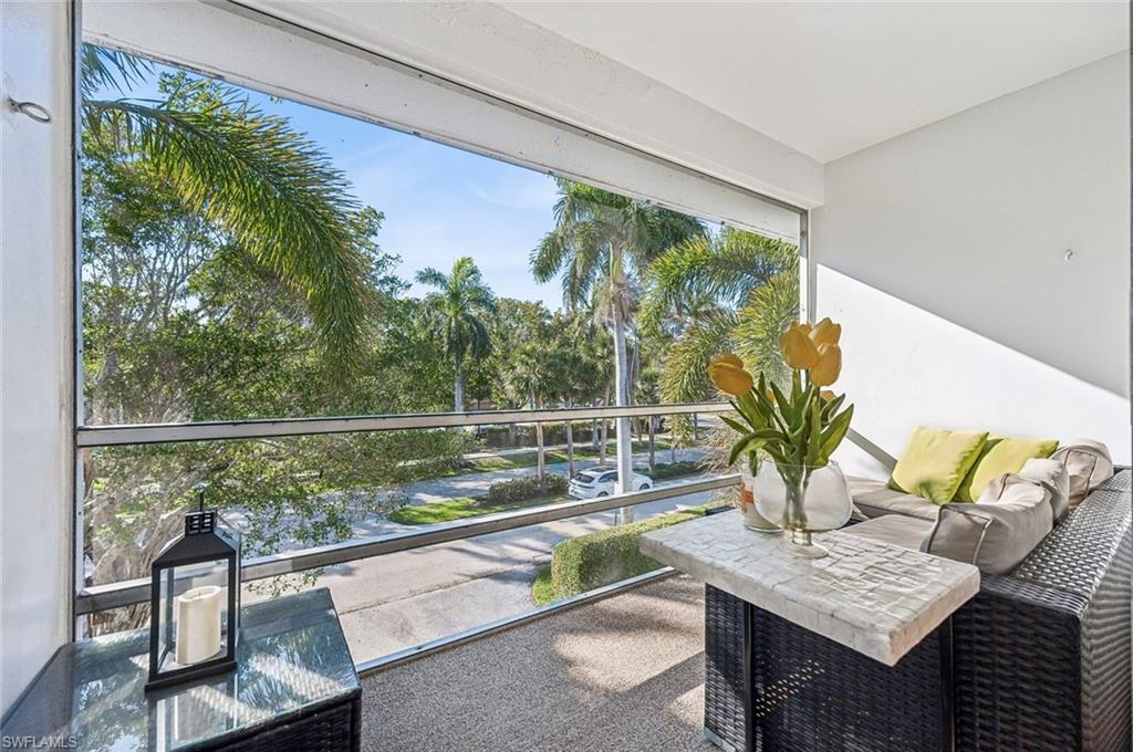 72 7th Street South, Unit 305 Naples, FL 34102 - Photo 16 of 26 a view of sitting area with furniture