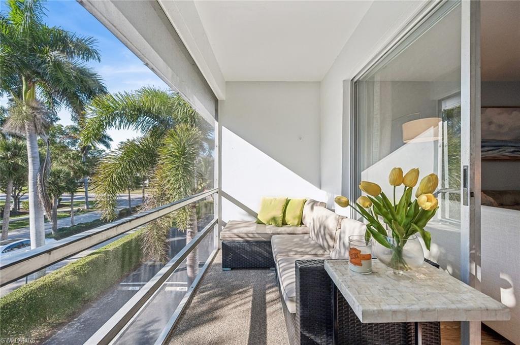 72 7th Street South, Unit 305 Naples, FL 34102 - Photo 17 of 26 a view of a balcony with chairs