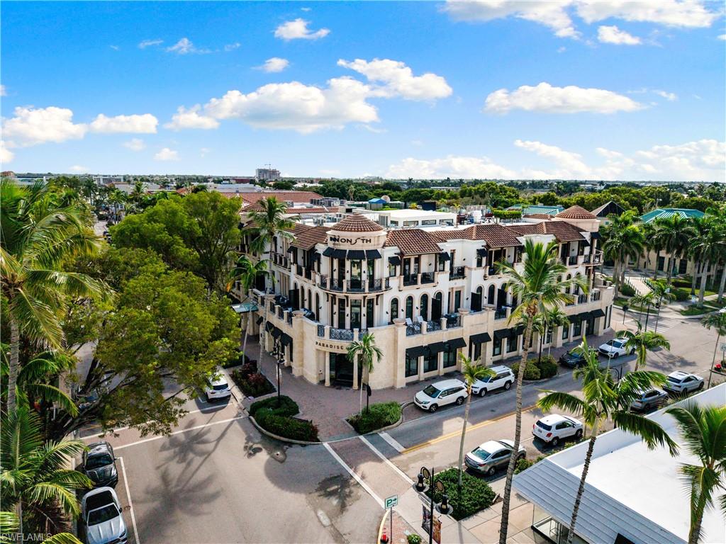 72 7th Street South, Unit 305 Naples, FL 34102 - Photo 24 of 26 an aerial view of a house with a yard
