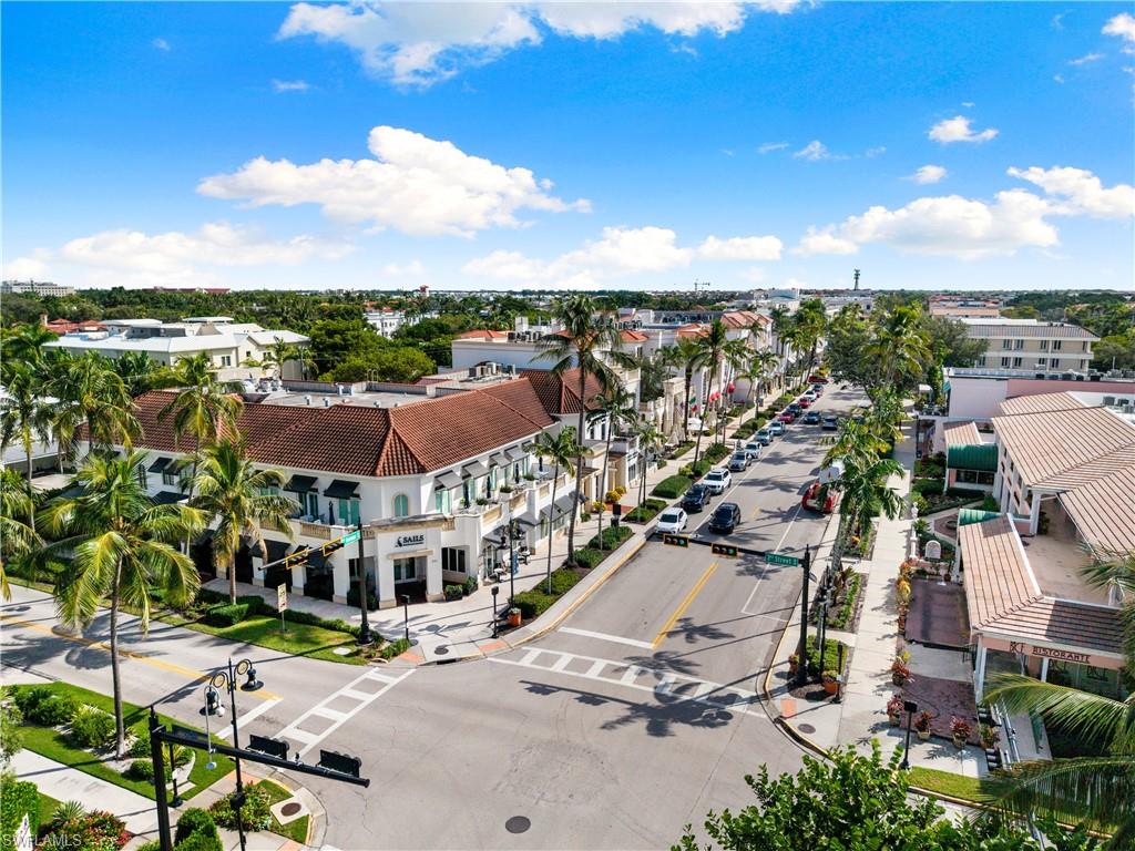 72 7th Street South, Unit 305 Naples, FL 34102 - Photo 26 of 26 an aerial view of residential houses with outdoor space and ocean view