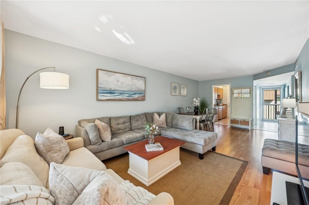 72 7th Street South, Unit 305 Naples, FL 34102 - Photo 3 of 26 a living room with furniture and a couch