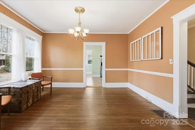a kitchen with stainless steel appliances a refrigerator and a stove top oven