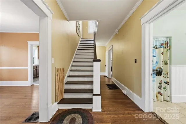 a bathroom with a sink mirror vanity and toilet
