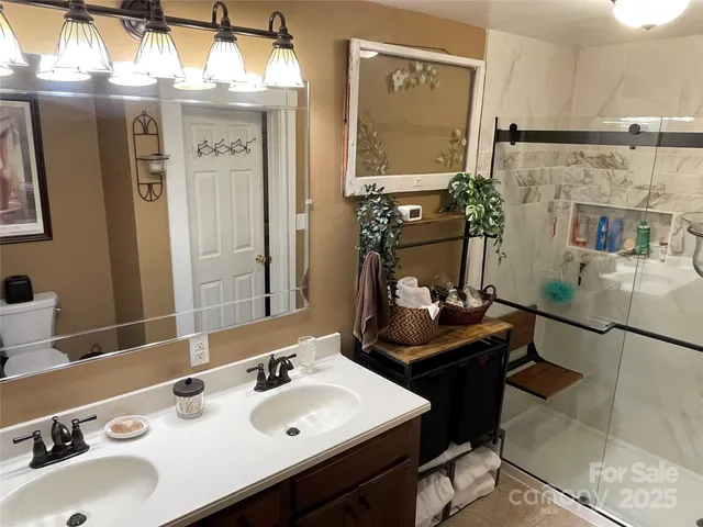 a bathroom with a sink vanity and a mirror