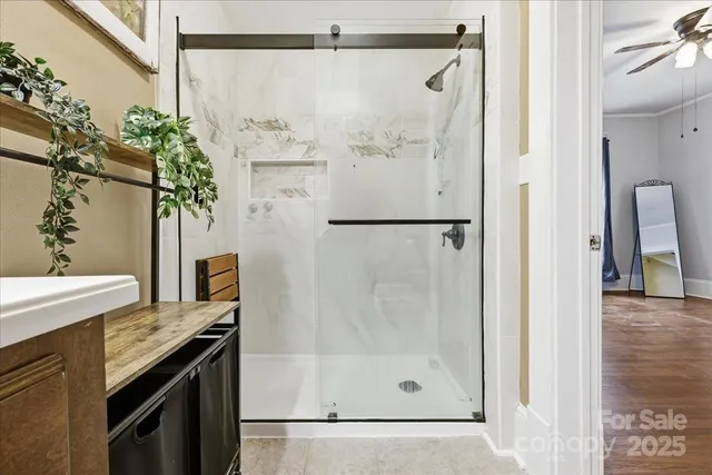 a view of a bathroom with a tub and shower