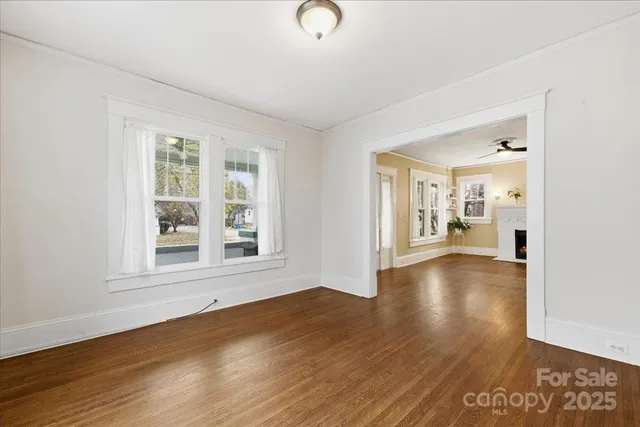a view of a livingroom with wooden floor