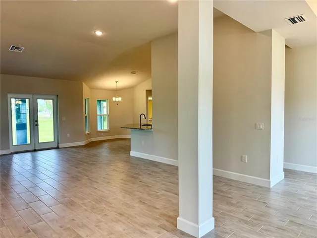 a view of a kitchen with a sink and a stove top oven