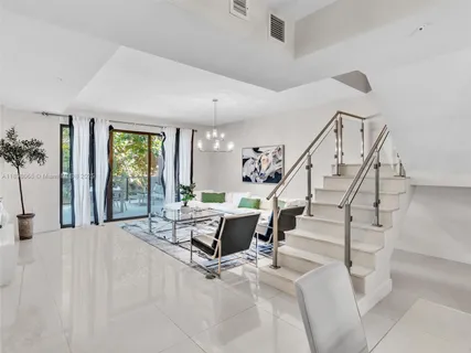 a view of livingroom with furniture and workspace