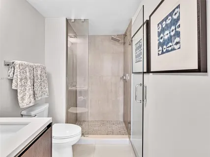 a bathroom with a shower and a toilet
