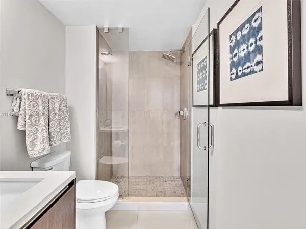 a bathroom with a shower and a toilet