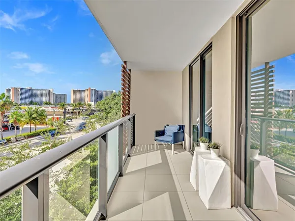 a view of balcony with furniture