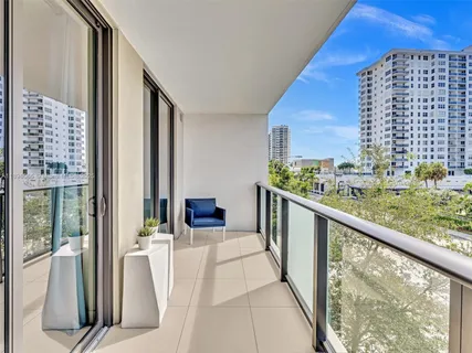 a view of a chairs and table in backyard
