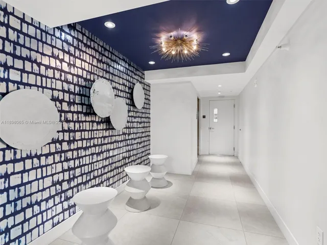 an aerial view of residential building and ocean