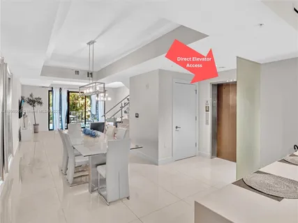 a view of a livingroom with furniture and chandelier fan