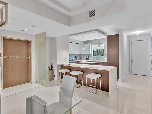 a spacious bathroom with a sink a mirror and a bathtub