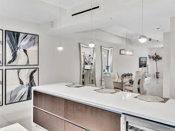 a bathroom with a sink a mirror and a shower