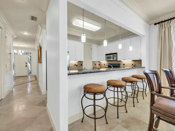 a large kitchen with a lot of counter space and a sink