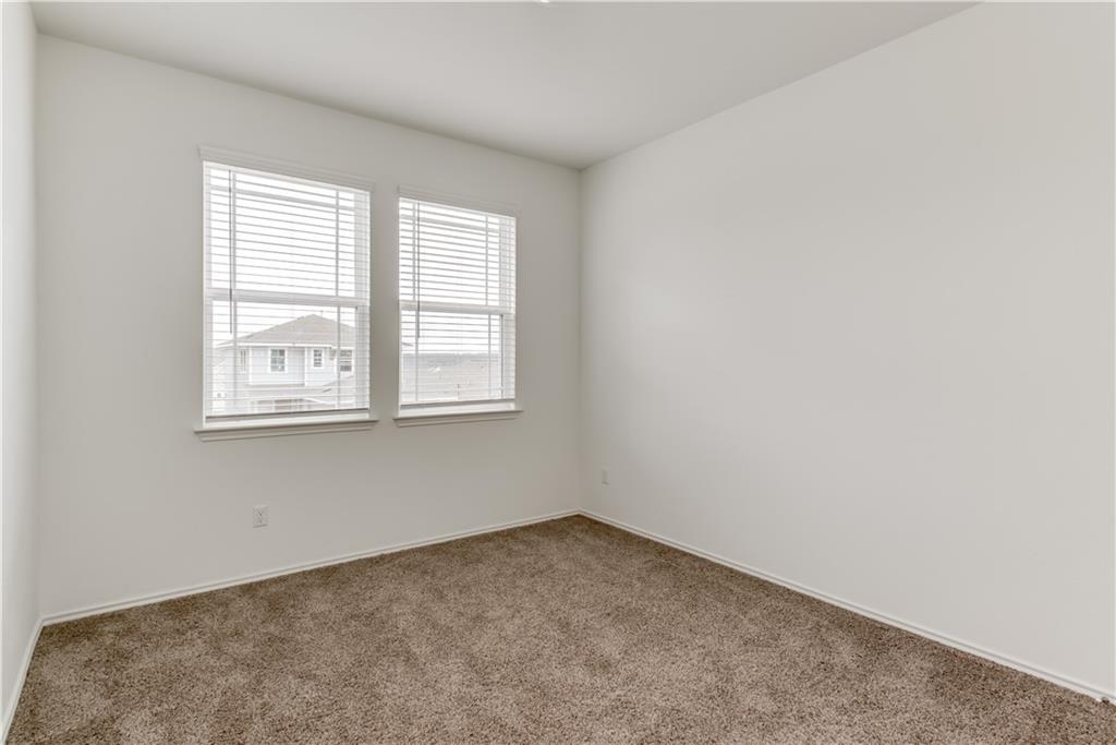 712 Affazia Lane Georgetown, TX 78628 - Photo 13 of 40 an empty room with a window