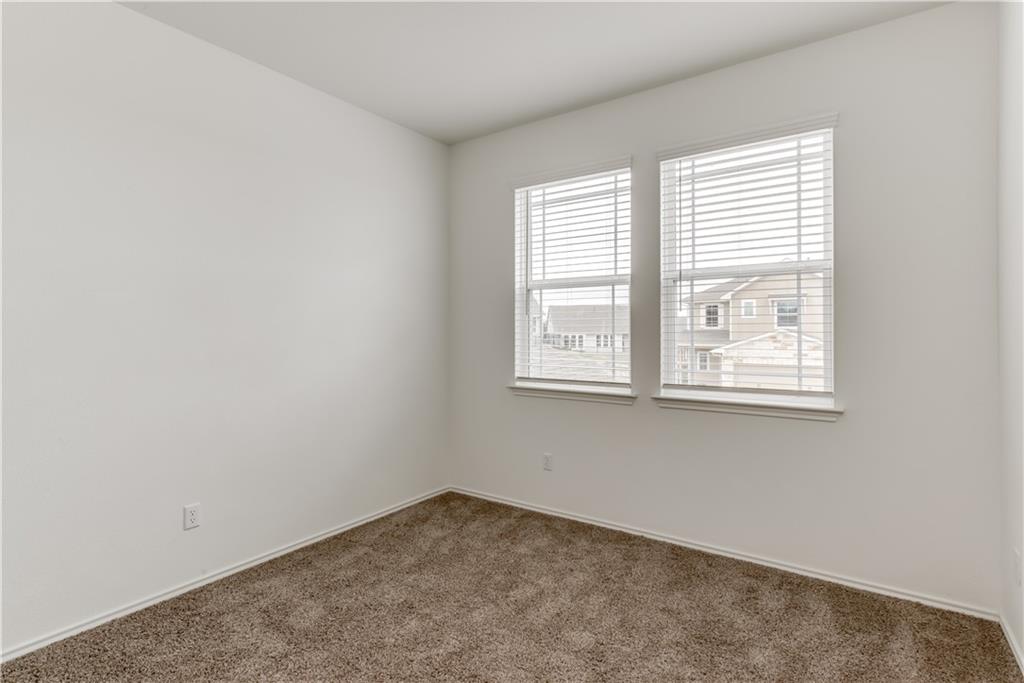 712 Affazia Lane Georgetown, TX 78628 - Photo 14 of 40 an empty room with a window